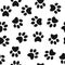 Black animal paw prints seamless pattern vector