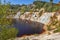 Black artificial lake and hills - mining and production of copper in Bor, Serbia