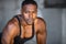 Black athlete, fitness trainer portrait, muscular powerful expression headshot, urban workout