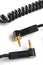 Black audio cable with two gold stereo plugs 3,5mm isolated on w