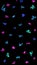 Black background with colored spots. Blue and purple