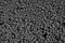 Black background from gravel texture. Friable building material, consisting of pieces of rock of different size