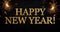 Black background with sparklers and glittery letters showing the words happy new year