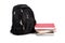 Black backpack with text books on white