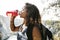 Black backpacker woman drinking water