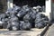 Black bags that put garbage inside and tie the bag stack in the garbage collection point.