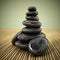 Black balancing stones standing on bamboo background. 3D illustration
