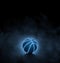 black basketball with bright blue glowing neon lines on black background with smoke