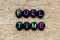 Black bead with letter in word full time on wood background