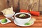 Black bean mexican soup with chips and lime.