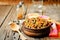 Black beans, quinoa and corn chili on a wood background