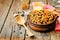 Black beans, quinoa and corn chili on a wood background