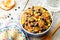 Black beans, quinoa and corn chili on a wood background