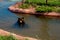 Black Bear swimming in the pond in Bear Country Park , Rapid City , SD ,USA