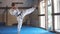 Black belt karate fighter training hight kick