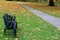 Black bench on secluded path