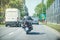 Black biker with motorcycle driving on highway.