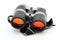 Black binoculars with orange lens