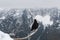 Black bird, alpine cough (Pyrrhocorax graculus) in snowy landscapes in the Julian Alps, Slovenia