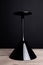 Black on black: one elegant black glass martini glass on black t