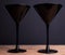 Black on black: two elegant black glass martini glasses on black