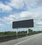 Black blank billboards or advertising poster on side of express way or overpass on blue sky background in advertise concept