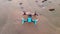 Black and blue drone standing on the sand