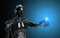 Black and blue intelligent robot cyborg pointing finger on dark 3D rendering