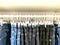 Black and blue jeans hanger display  on sell in store.vintage denim fabric collection nature material retro style