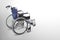 Black and blue wheel chair on grey background, object, transport, banner, template, copy space