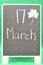 A black board with the date 17 March - Saint Patrickâ€™s day