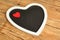 Black board heart decorated with a red heart