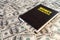 Black book with money and the inscription money management on banknotes background