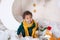 Black boy in a green sweater and a yellow scarf smiling. Portrait of a little African American. Baby smiles. Black guy The child e