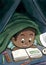 Black Boy Hiding Beneath the Blanket Reading a Picture Book