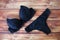 Black bras and panties on wooden background