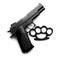 Black brass knuckles and gun on white background, top view