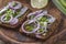 Black bread sandwiches with salted sprat carcasses with onions and parsley