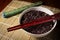 Black brow rice in bowl with chopstick.