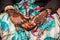 Black and Brown Henna Hands Drawings on Women for African Wedding Ceremony with Big Rings.