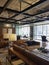 Black and brown modern co working creative office workplaces in co working center with brown sofa,wood table,desk working