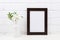 Black brown poster frame mockup with Tobacco flowers