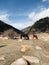 Black and browsn horses grazing in the mountains