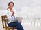 Black business woman, coffee and laptop on bench, promenade and portrait with smile, drink and beach. Entrepreneur