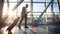 Black Businessman Using Mobile Phone Walking In Airport, Panorama, Side-View