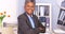 Black businesswoman sitting at desk smiling