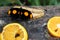 Black butterfly with orange spots on fruits, banana and oranges