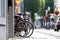 Black bycicles parked on the street with blurry background