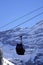 Black cable car cabin with mountains behind at the ski resort Seiser Alm, Italy.