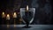 Black Candle in Glass Beaker on Blurred Matte Background